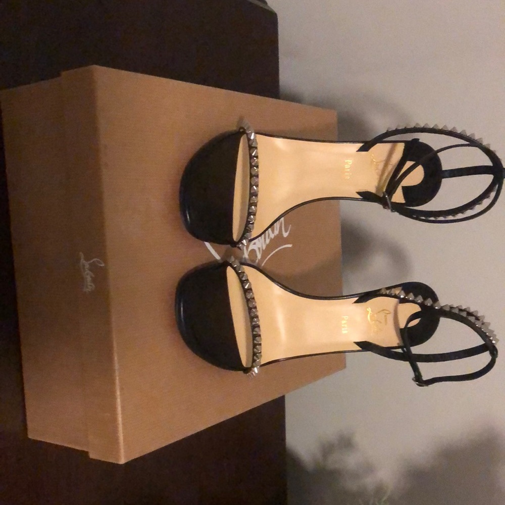 Brand New Christian Louboutin leather sandals with spike trim
4"  stiletto heel
